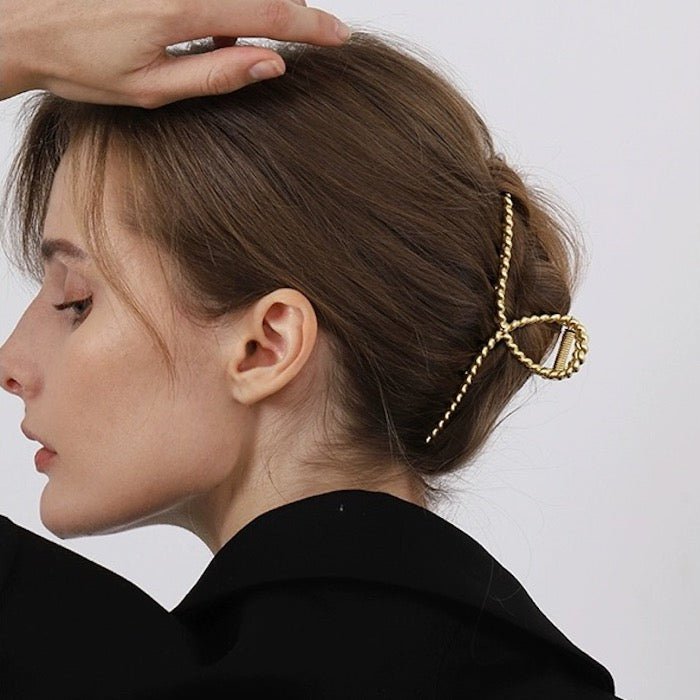 Minimalistische gedraaide lijn grote klauw haarclip