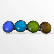 Close-up van de Color Hairclip XL met paars, blauw, olijf en bruin – handgemaakte haarspeld met cabochon details