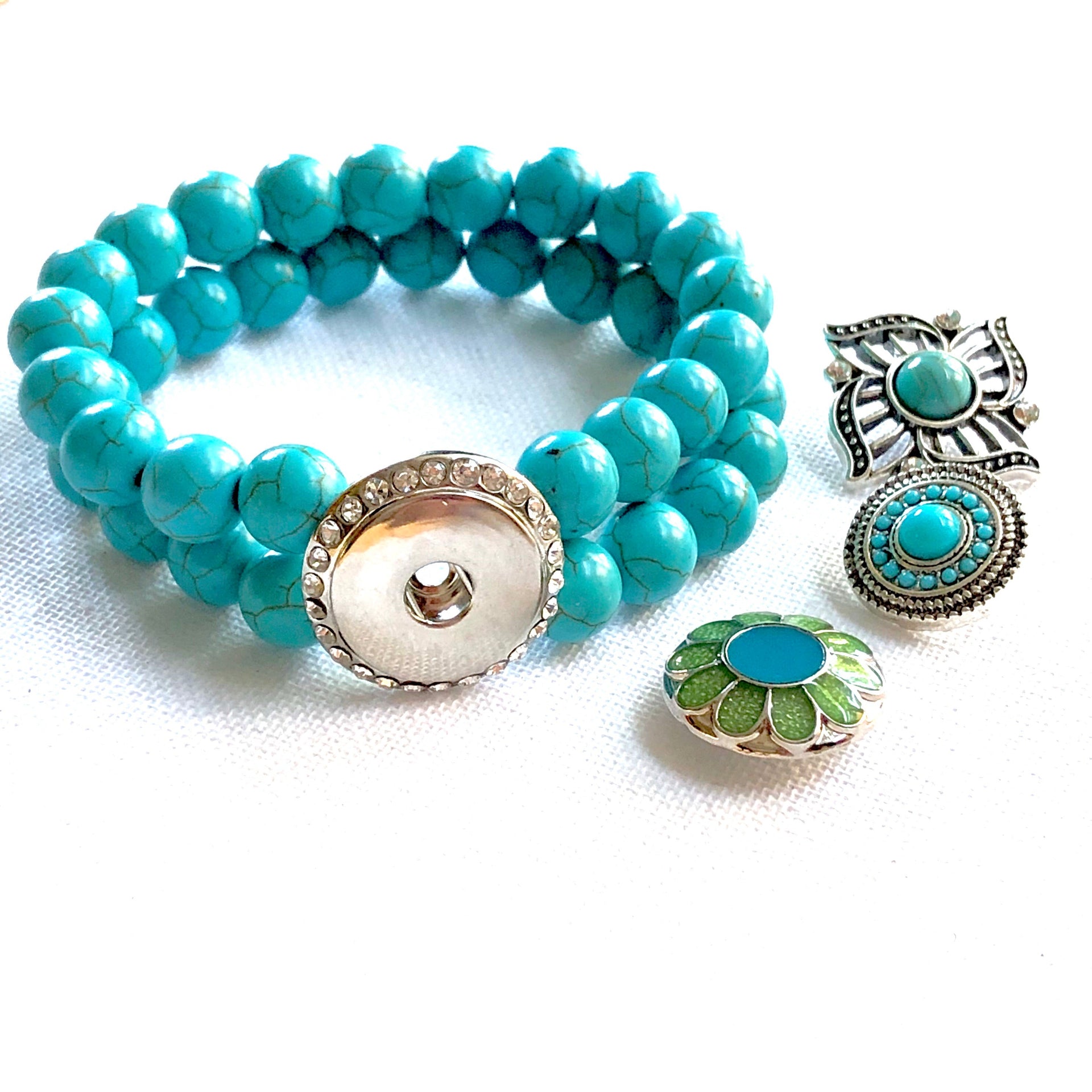 Armband dubbel kralen clicks /buttons turquoise